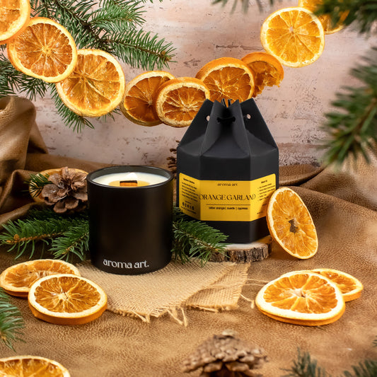 A 7oz soy-coconut crackling wooden wick called Orange Garland with notes of bitter orange, suede, and cypress. A woodsy, citrusy scent evoking a cozy autumnal environment.